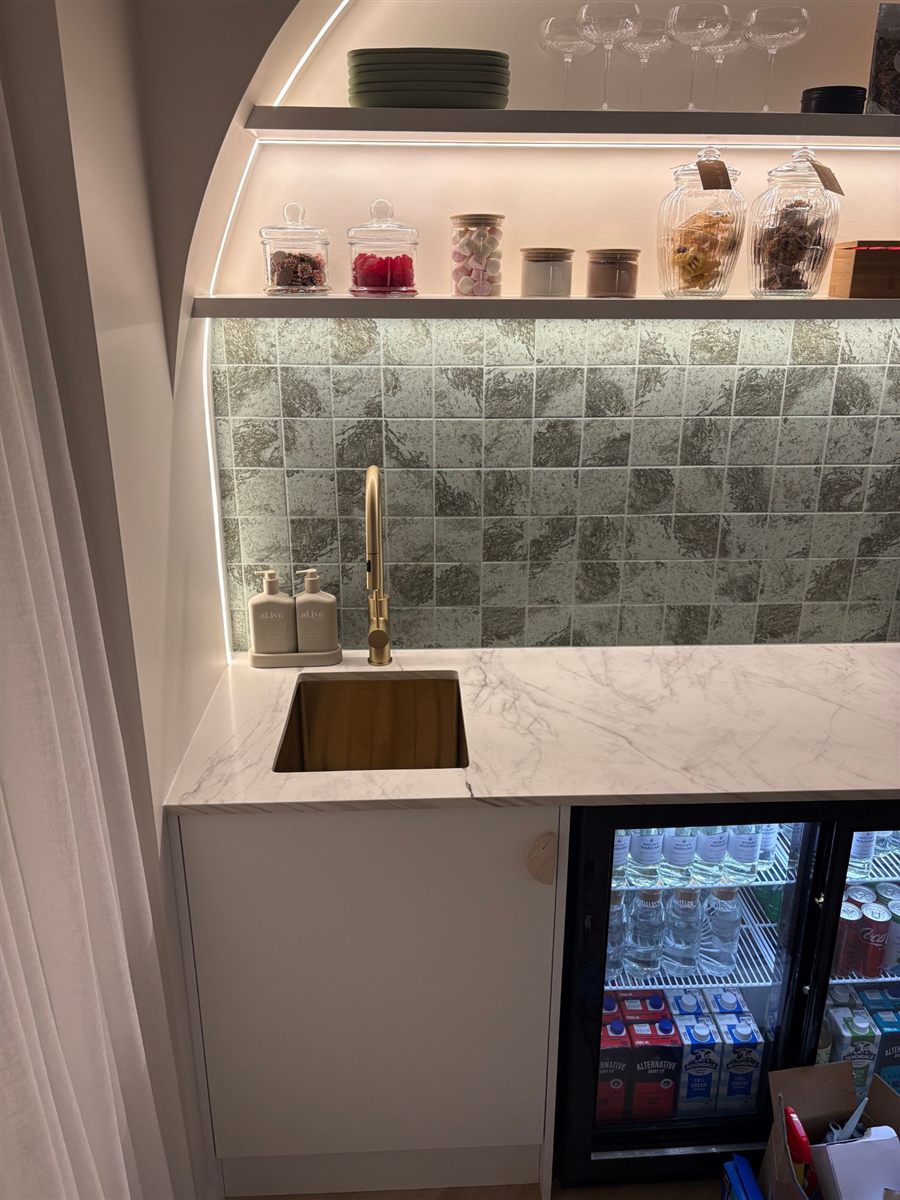 Kitchenette with brass tap and undermount sink